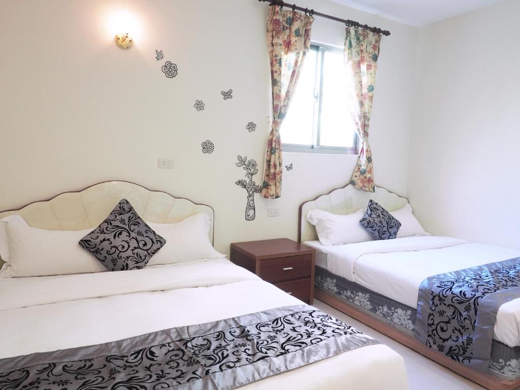 Postel nebo postele na pokoji v ubytování Siang Ti Ya Homestay