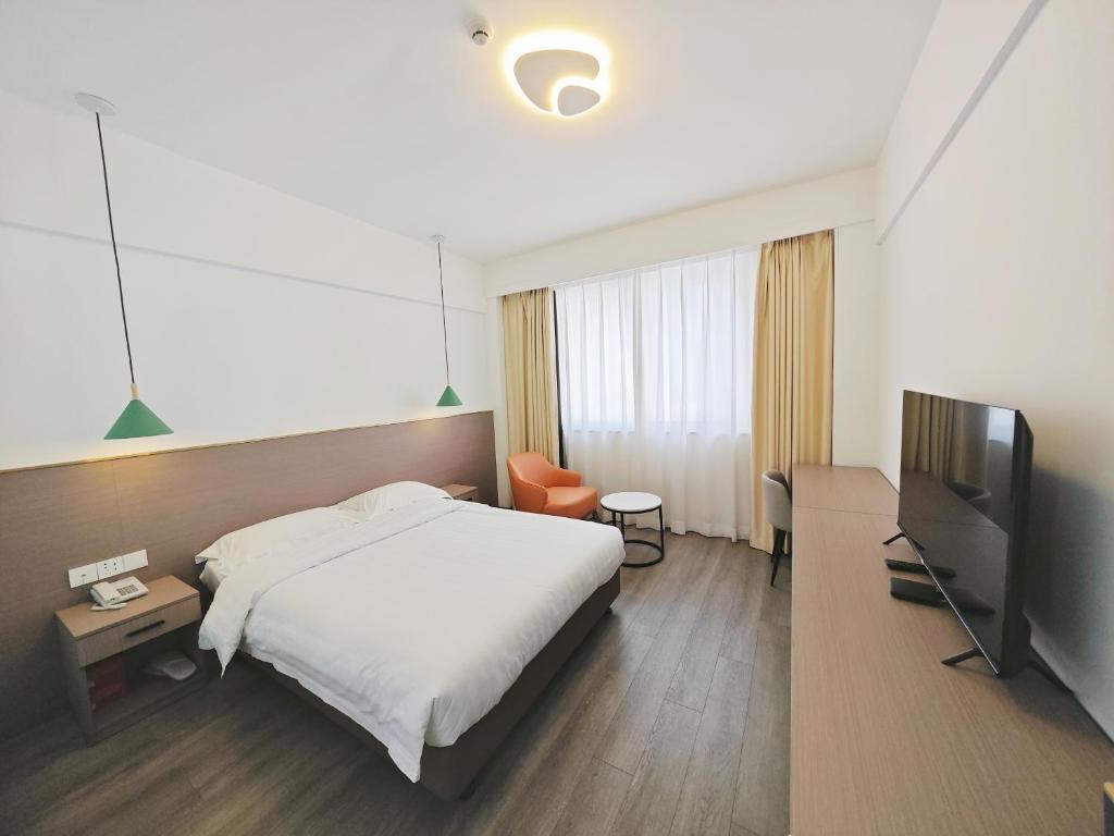 TV a/nebo společenská místnost v ubytování Shenzhen Xinghua Hotel