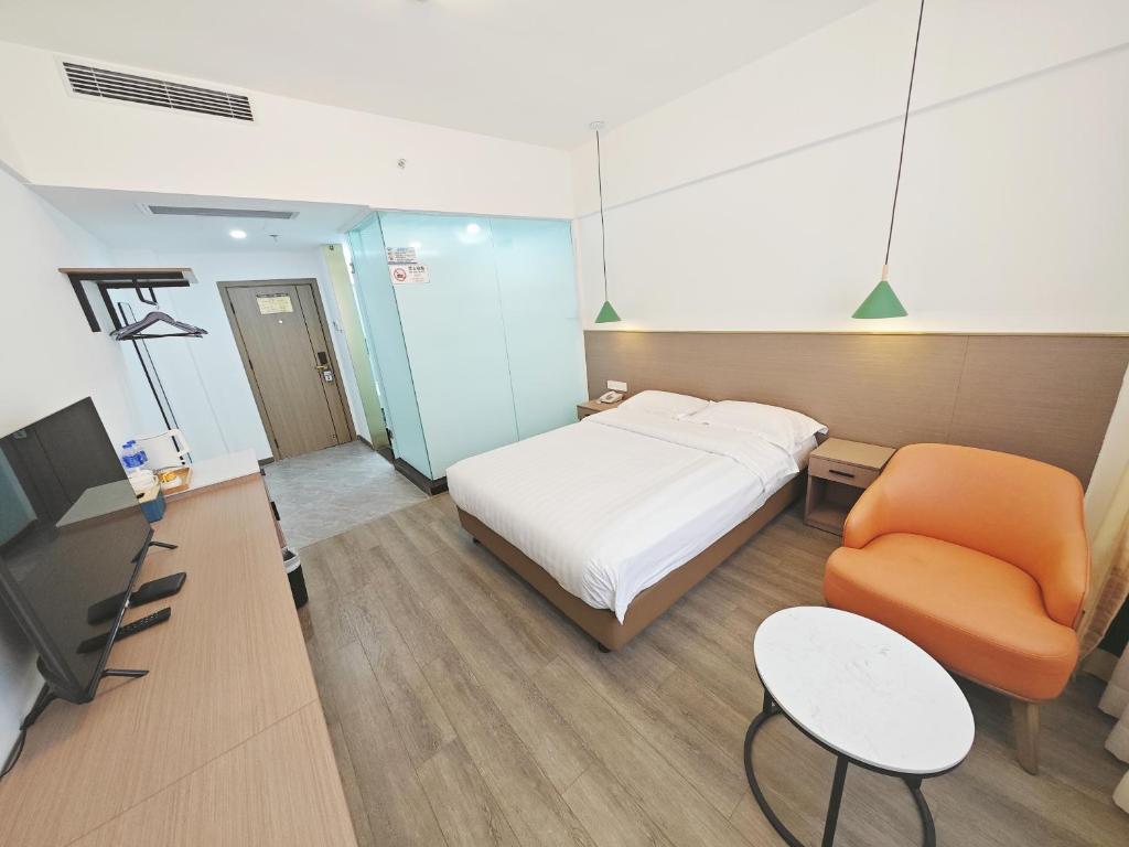 TV a/nebo společenská místnost v ubytování Shenzhen Xinghua Hotel