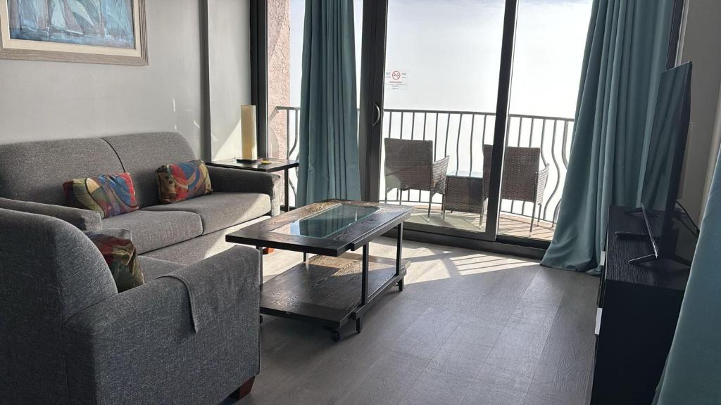 a living room with a couch and a coffee table at Oceanfront Penthouse, Two-Story, 3 Bedrooms in Myrtle Beach