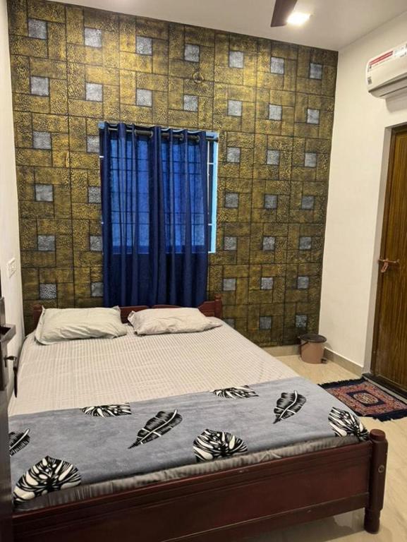 Postel nebo postele na pokoji v ubytování Dream House FORT KOCHI
