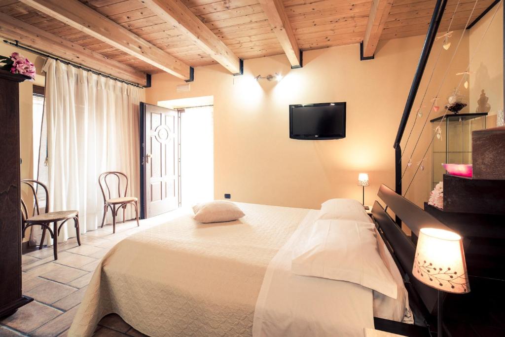 Łóżko lub łóżka w pokoju w obiekcie B&B La Casa Di Plinio