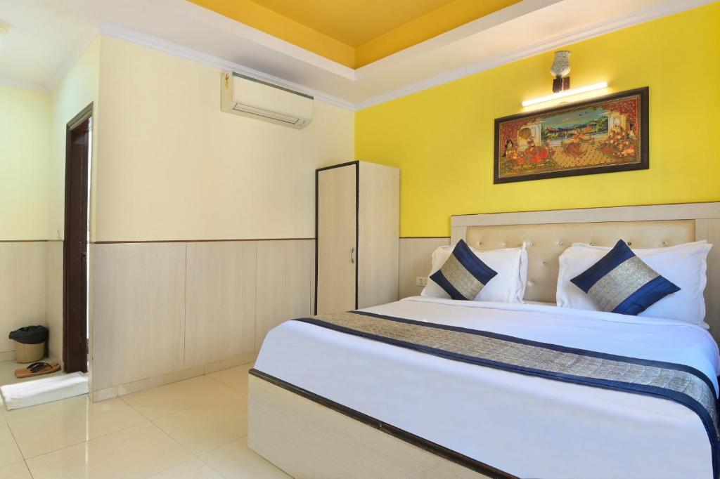 Postel nebo postele na pokoji v ubytování Hotel Oakwood