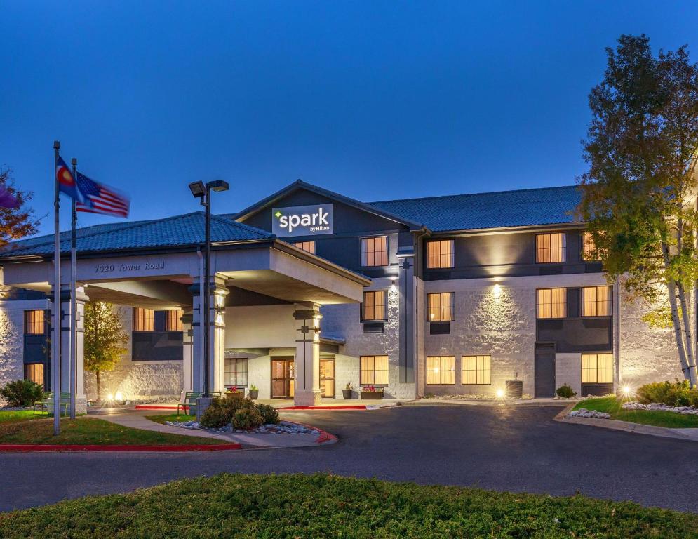 a hotel building with a sign that reads spitz at Spark by Hilton Denver International Airport in Denver