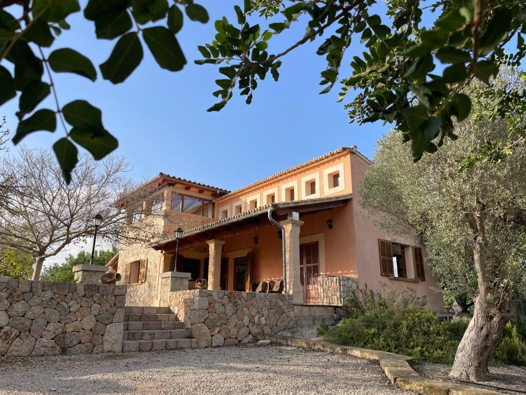 an image of a house with a stone wall at Casa Moragues in Santa Maria del Camí