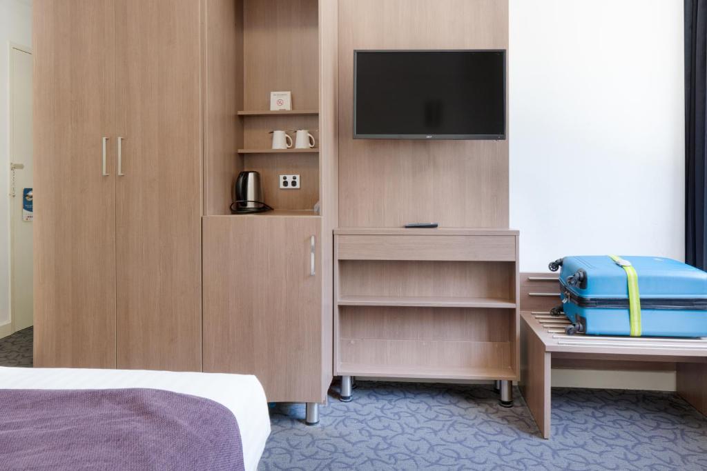 Postel nebo postele na pokoji v ubytování Quality Hotel Ambassador Perth