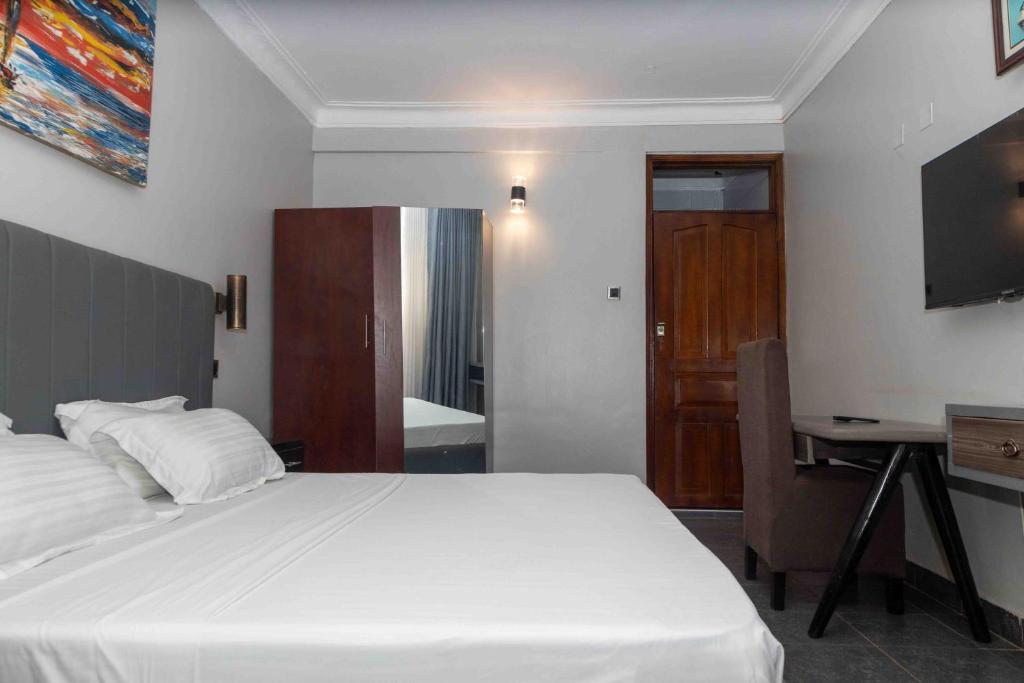Postel nebo postele na pokoji v ubytování Mirembe Hotels - Source of the Nile Suites
