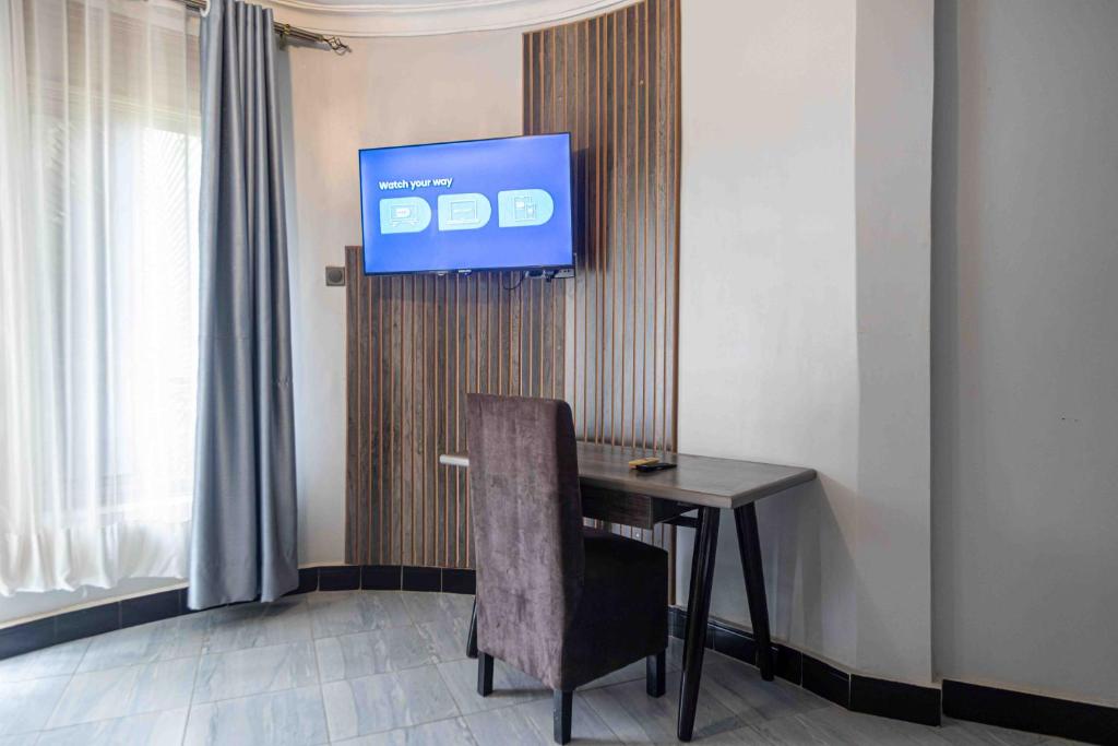 TV a/nebo společenská místnost v ubytování Mirembe Hotels - Source of the Nile Suites