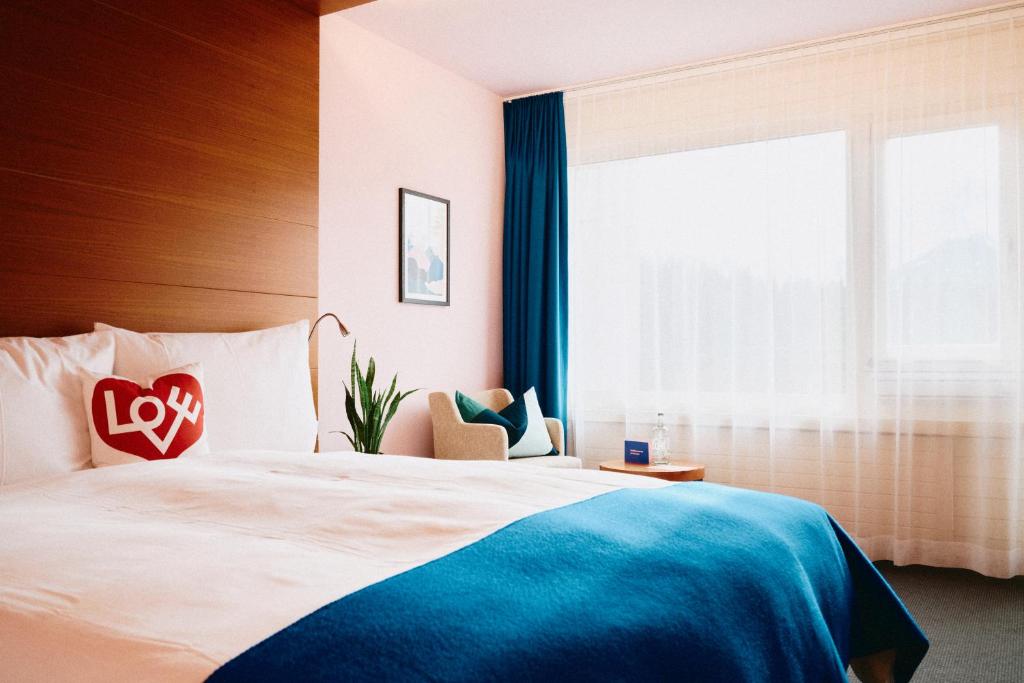 Postel nebo postele na pokoji v ubytování signinahotel