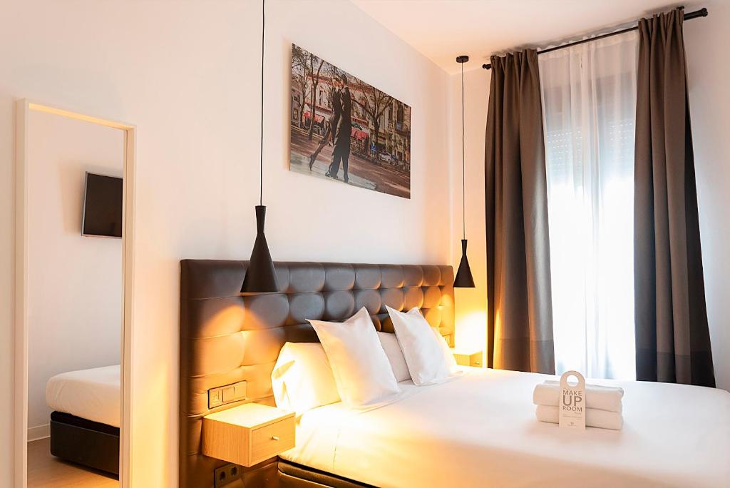 Postel nebo postele na pokoji v ubytování Woohoo Rooms Chueca