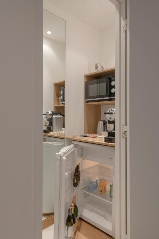 Kuchyň nebo kuchyňský kout v ubytování MiHotel Le Gourguillon