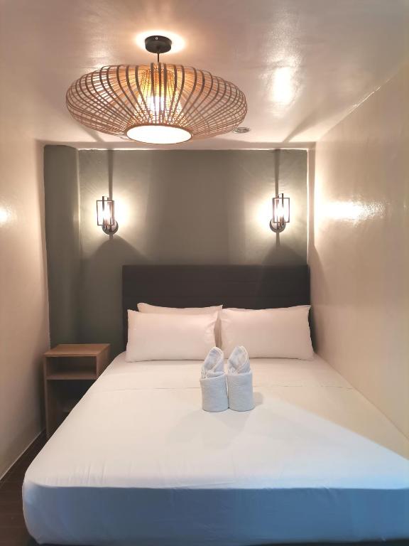 Postel nebo postele na pokoji v ubytování Viewpoint 360 Hotel