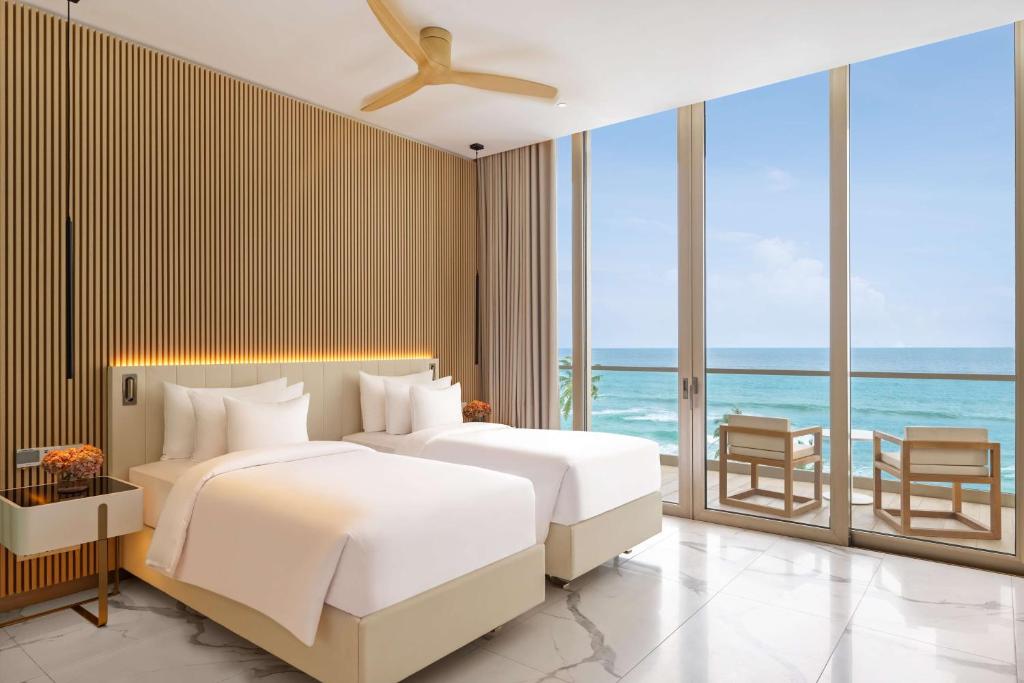 Postel nebo postele na pokoji v ubytování Radisson Collection Resort Galle
