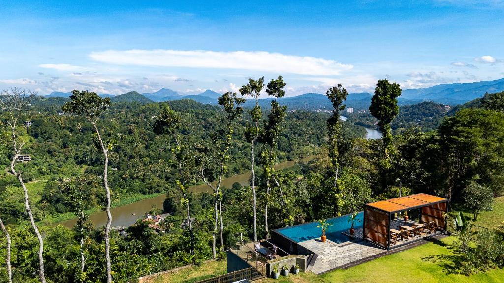a house on top of a hill with a view at Riverdale Bungalow - Film Location For 'Bridge On The River Kwai' in Kandy