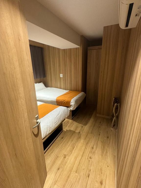 Postel nebo postele na pokoji v ubytování Popway Residence Tennoji