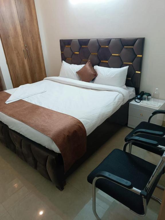 Letto o letti in una camera di Soooper Hotel