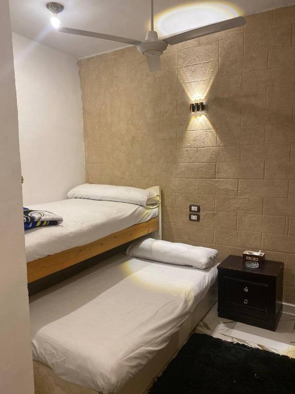 Postel nebo postele na pokoji v ubytování Bakar House