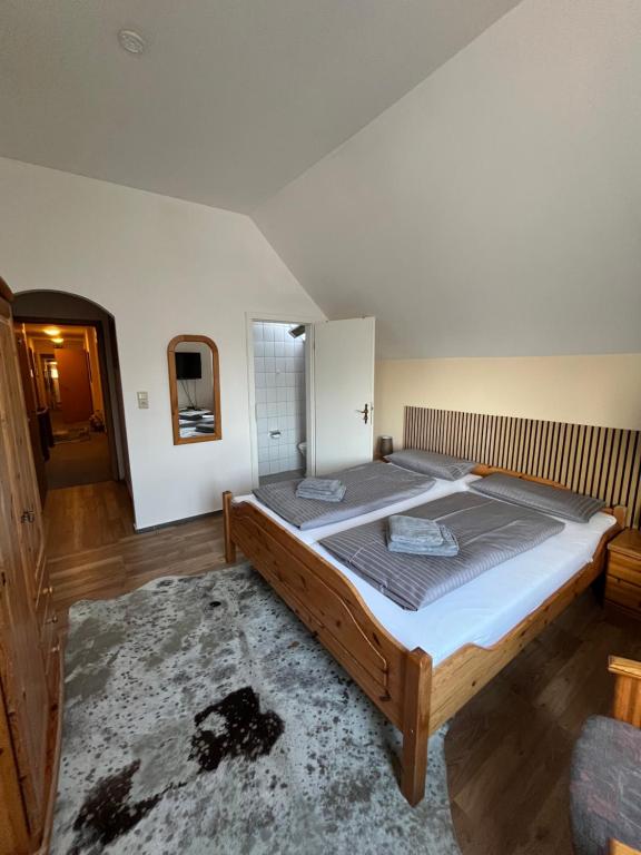 Postel nebo postele na pokoji v ubytování Hotel Mühleneck