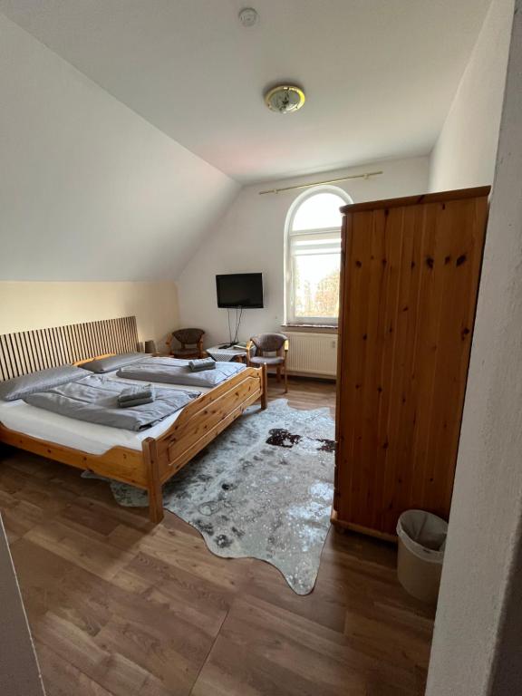 Postel nebo postele na pokoji v ubytování Hotel Mühleneck