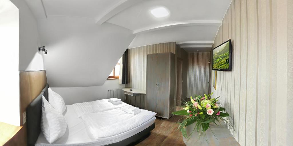 Postel nebo postele na pokoji v ubytování Hotel Am Markt