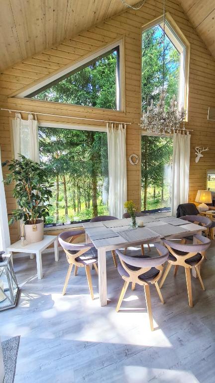 a large dining room with a large table and chairs at Kruszkanawierzbie in Kruszka