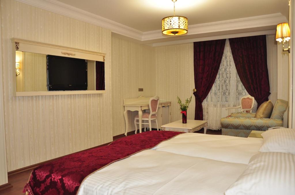 Postel nebo postele na pokoji v ubytování Muyan Suites