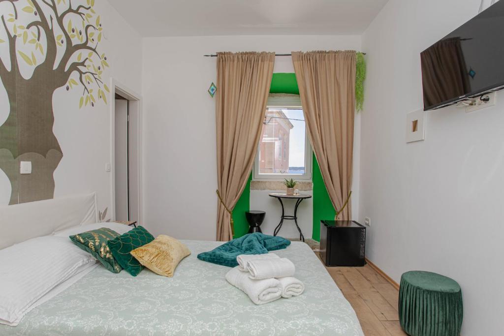 Postel nebo postele na pokoji v ubytování Guesthouse Mimbelli