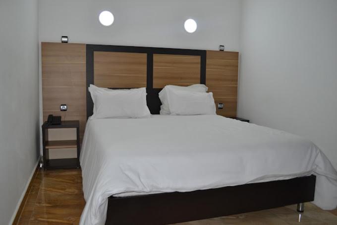Postel nebo postele na pokoji v ubytování Hotel D'orient