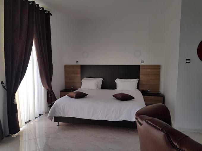Postel nebo postele na pokoji v ubytování Hotel D'orient
