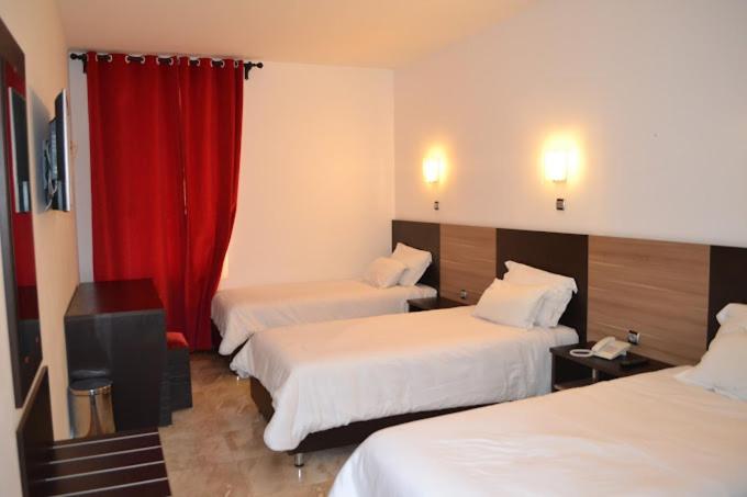 Postel nebo postele na pokoji v ubytování Hotel D'orient
