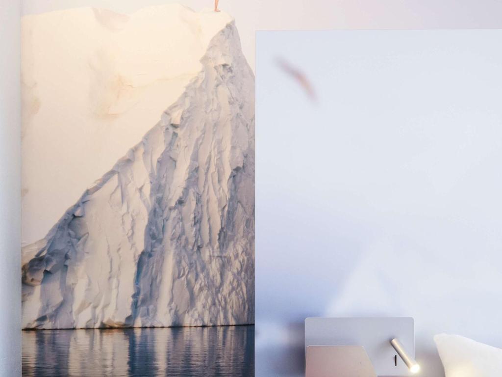 a painting of a glacier on a wall at ibis Styles Toulon Centre Port in Toulon