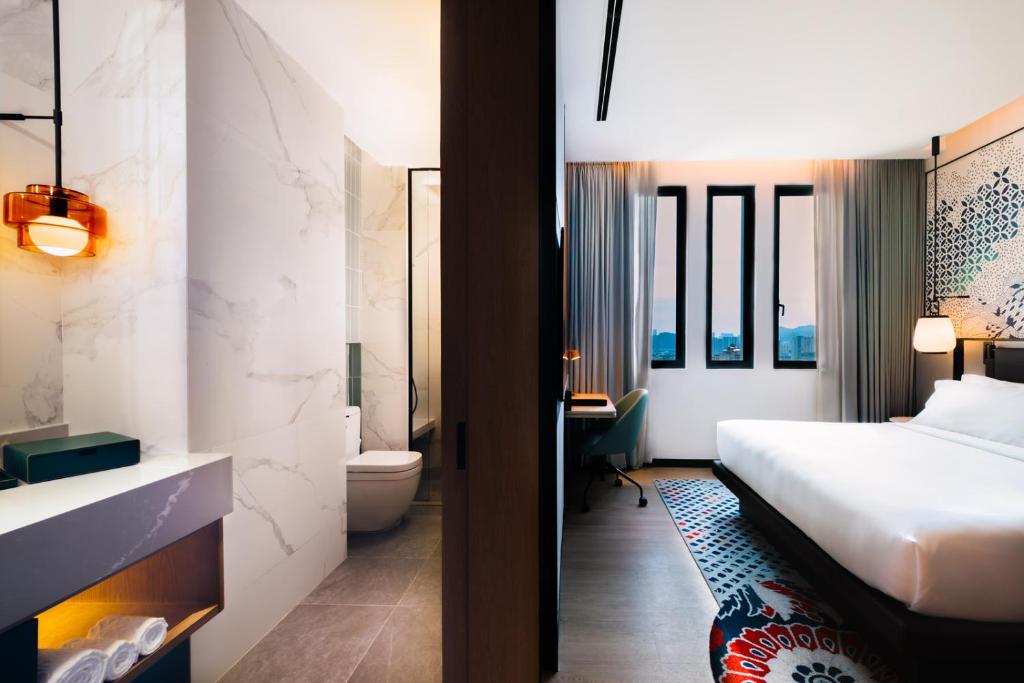 Iconic Marjorie Hotel, Penang, a Tribute Portfolio Hotel客房内的一张或多张床位