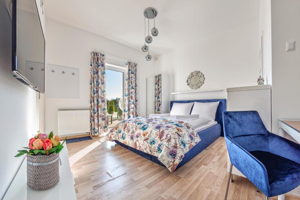 Ένα ή περισσότερα κρεβάτια σε δωμάτιο στο Seaside Butikowe Apartamenty II Grzybowo 200m od plaży