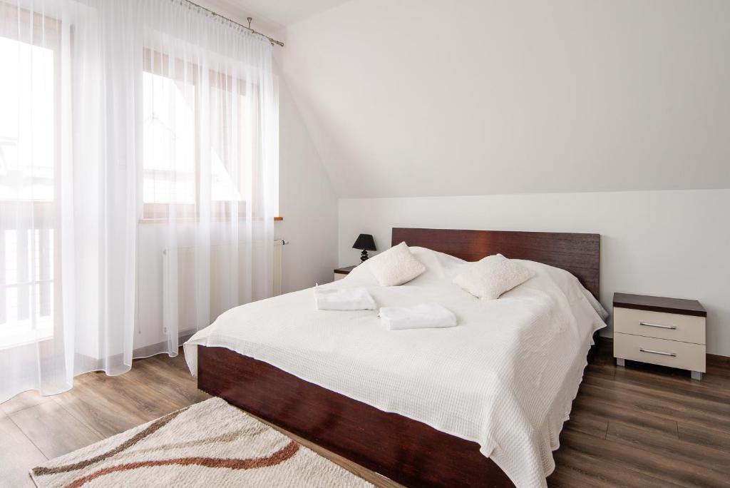 Posteľ alebo postele v izbe v ubytovaní Apartamenty Dagmara i Irka Zakopane