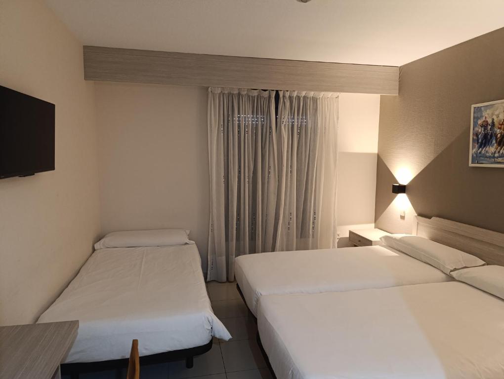 Cama o camas de una habitación en Hotel Villa De Pinto