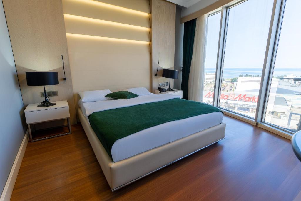 Postel nebo postele na pokoji v ubytování Konak Park Otel Yomra