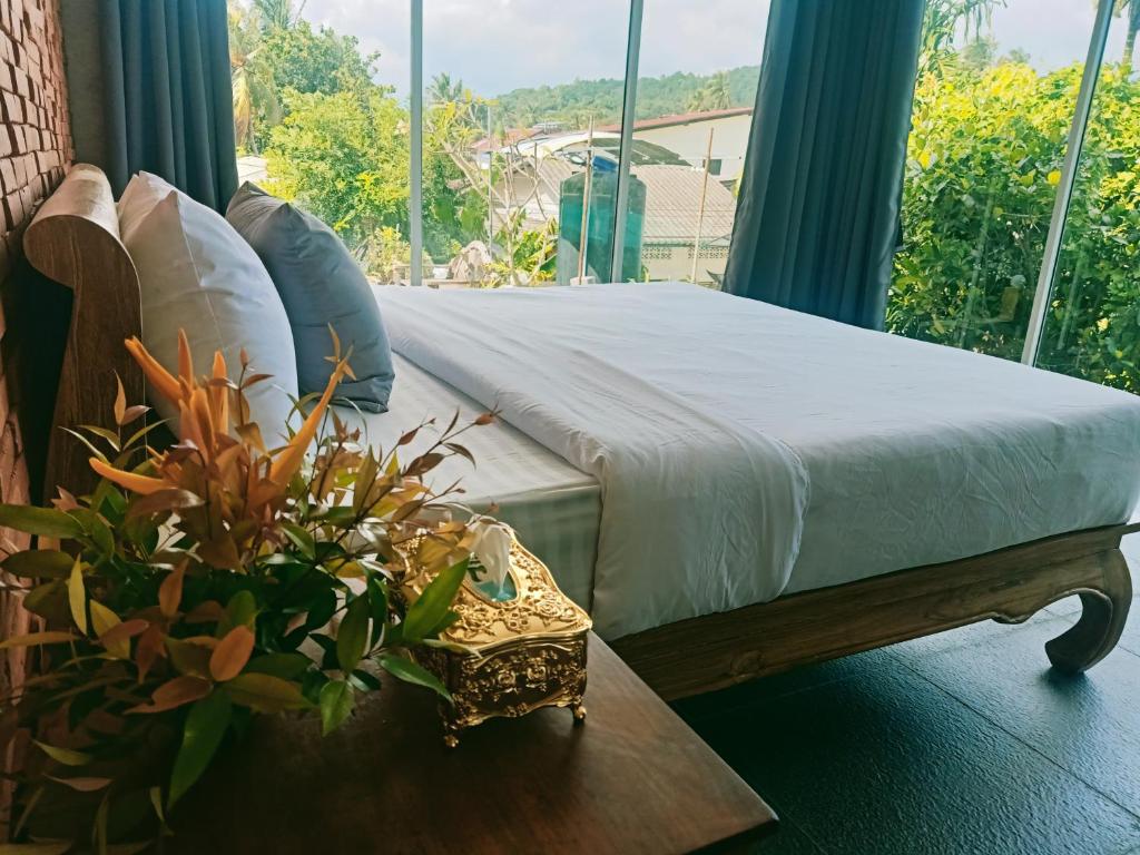 Postel nebo postele na pokoji v ubytování Anodash Homestay