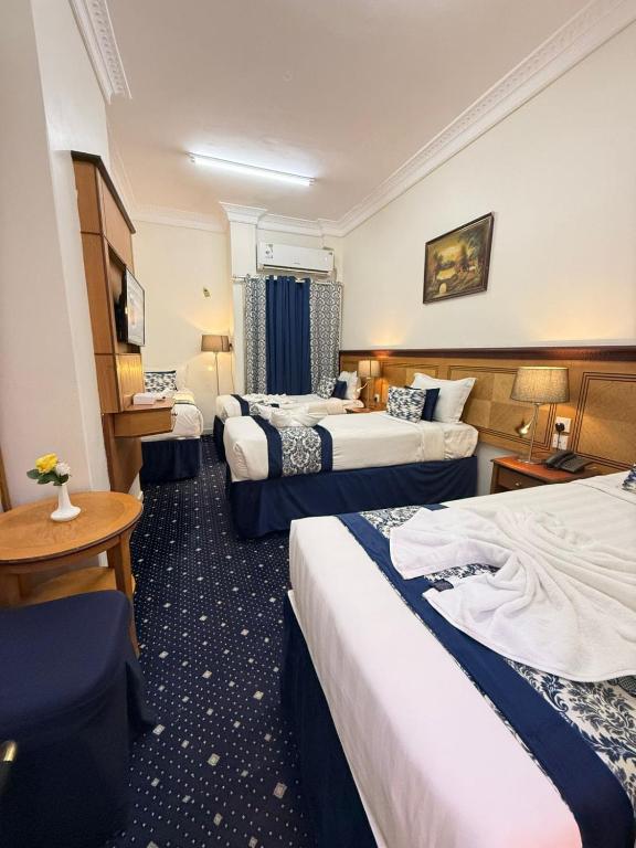 Voodi või voodid majutusasutuse Wahet Al Deafah Hotel toas