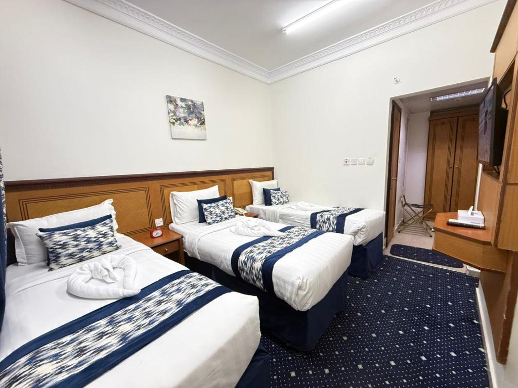 Voodi või voodid majutusasutuse Wahet Al Deafah Hotel toas