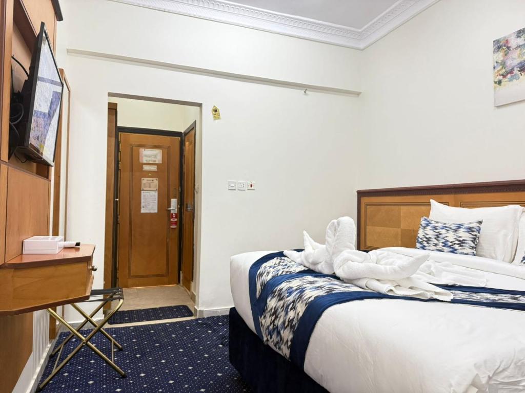 Voodi või voodid majutusasutuse Wahet Al Deafah Hotel toas