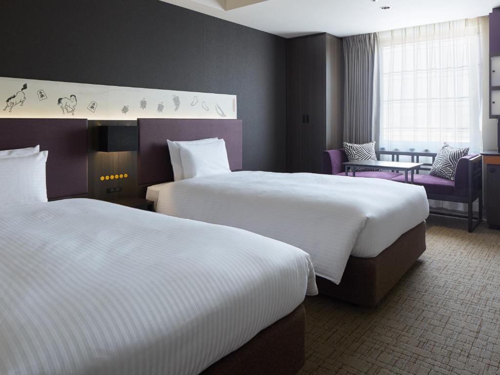 Postel nebo postele na pokoji v ubytování Mitsui Garden Hotel Kyobashi - Tokyo Station