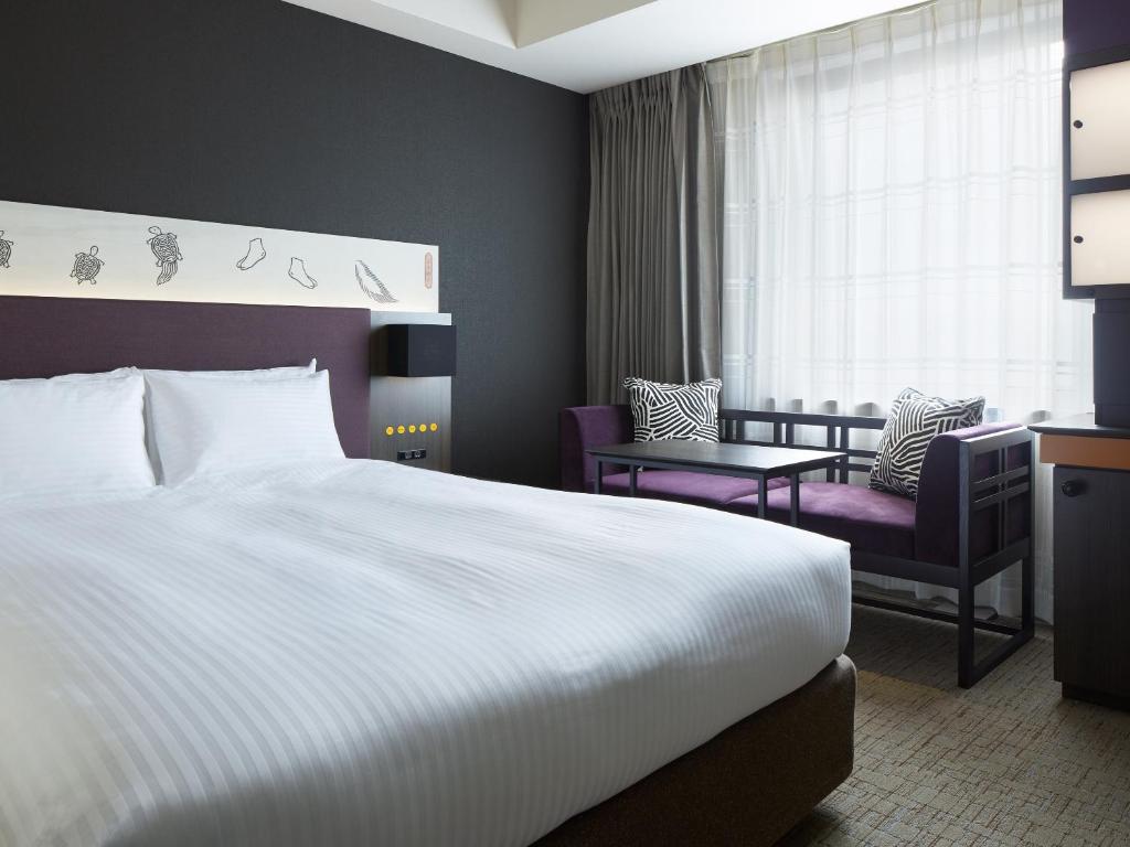 Postel nebo postele na pokoji v ubytování Mitsui Garden Hotel Kyobashi - Tokyo Station