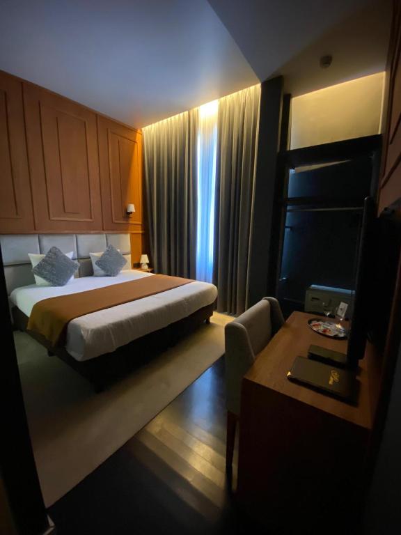 Postel nebo postele na pokoji v ubytování Hotel Esperance