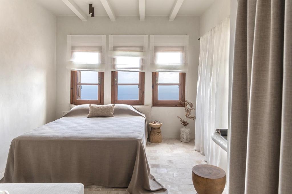 Postel nebo postele na pokoji v ubytování Om Living Pelion