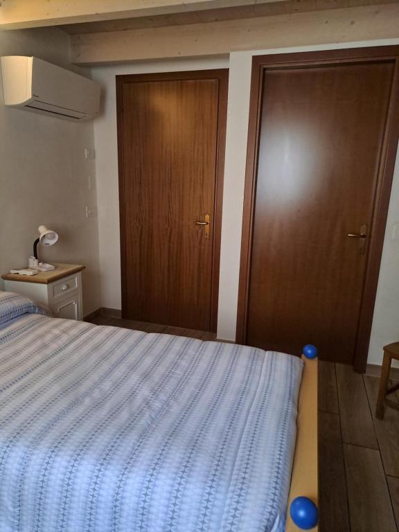 Letto o letti in una camera di B&B La Piazzetta