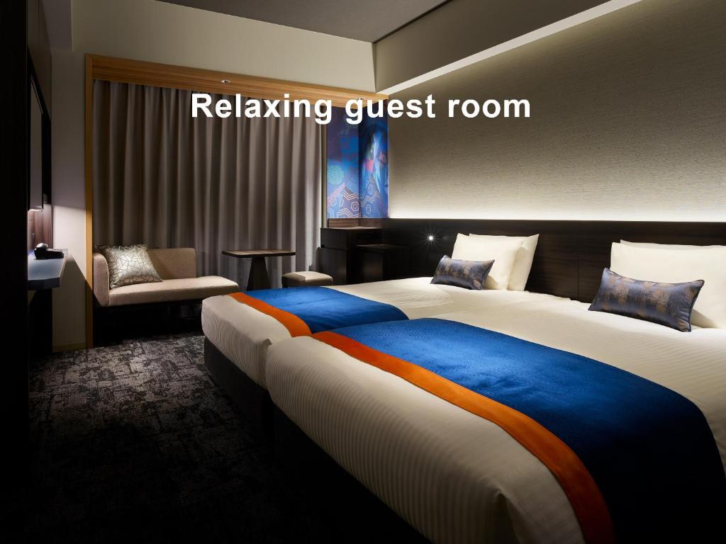 Postel nebo postele na pokoji v ubytování Mitsui Garden Hotel Ginza-gochome