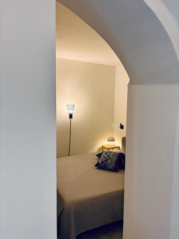 Postel nebo postele na pokoji v ubytování Hd Guesthouse Oasi urbana con parcheggio privato gratuito, fronte stazione