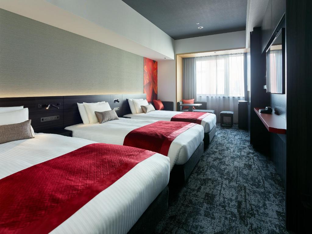 Postel nebo postele na pokoji v ubytování Mitsui Garden Hotel Ginza-gochome