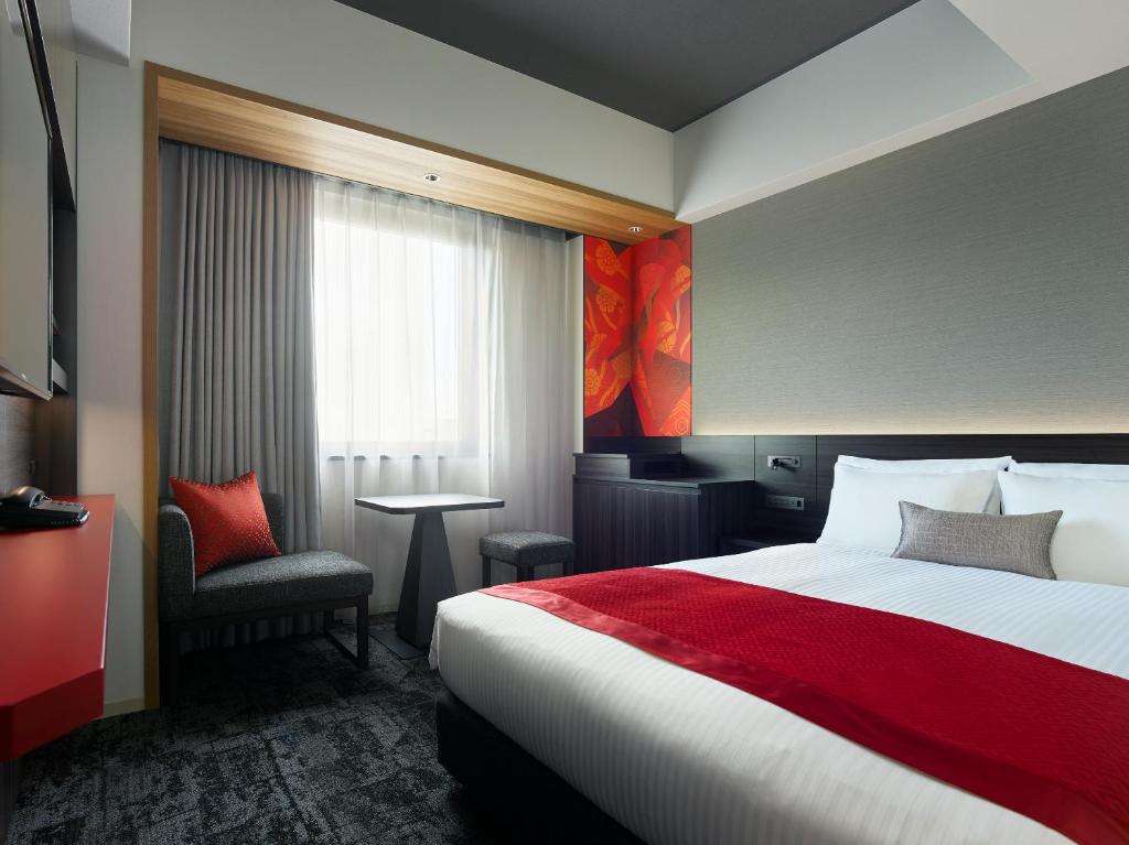 Postel nebo postele na pokoji v ubytování Mitsui Garden Hotel Ginza-gochome