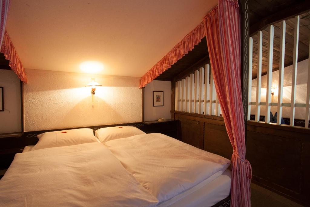 Postel nebo postele na pokoji v ubytování Berghotel Blaickner's Sonnalm